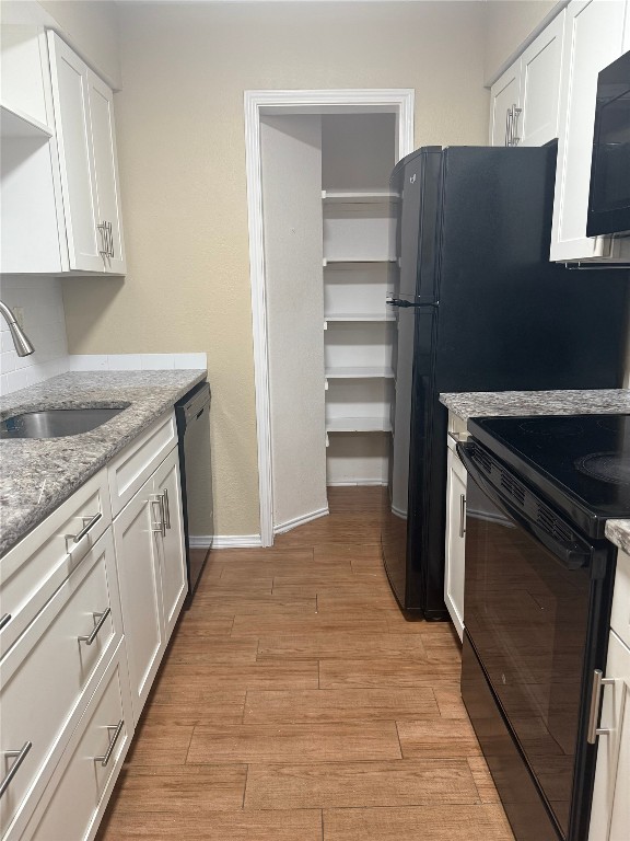 1808 Rio Grande Street, Unit 3 Austin, TX 78701 - Photo 5 of 29 a kitchen with stainless steel appliances granite countertop a refrigerator and a stove