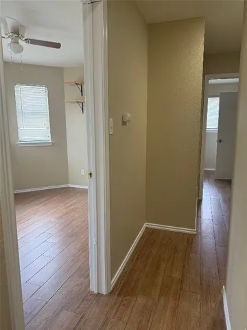 wooden floor and window in an empty room
