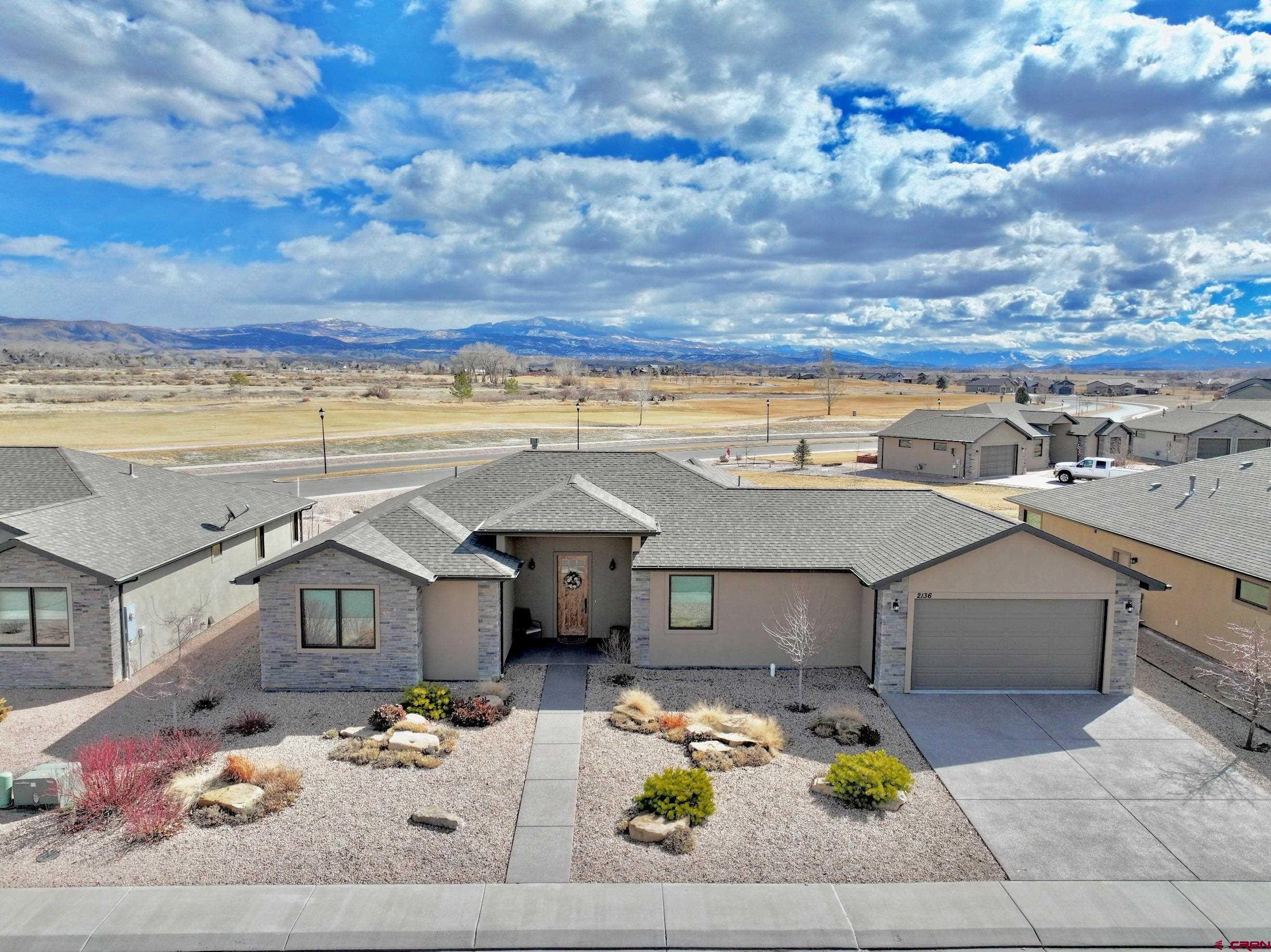 2136 Signature Ridge Lane Montrose, CO 81401 - Photo 1 of 32 a view of a terrace with a table and chairs