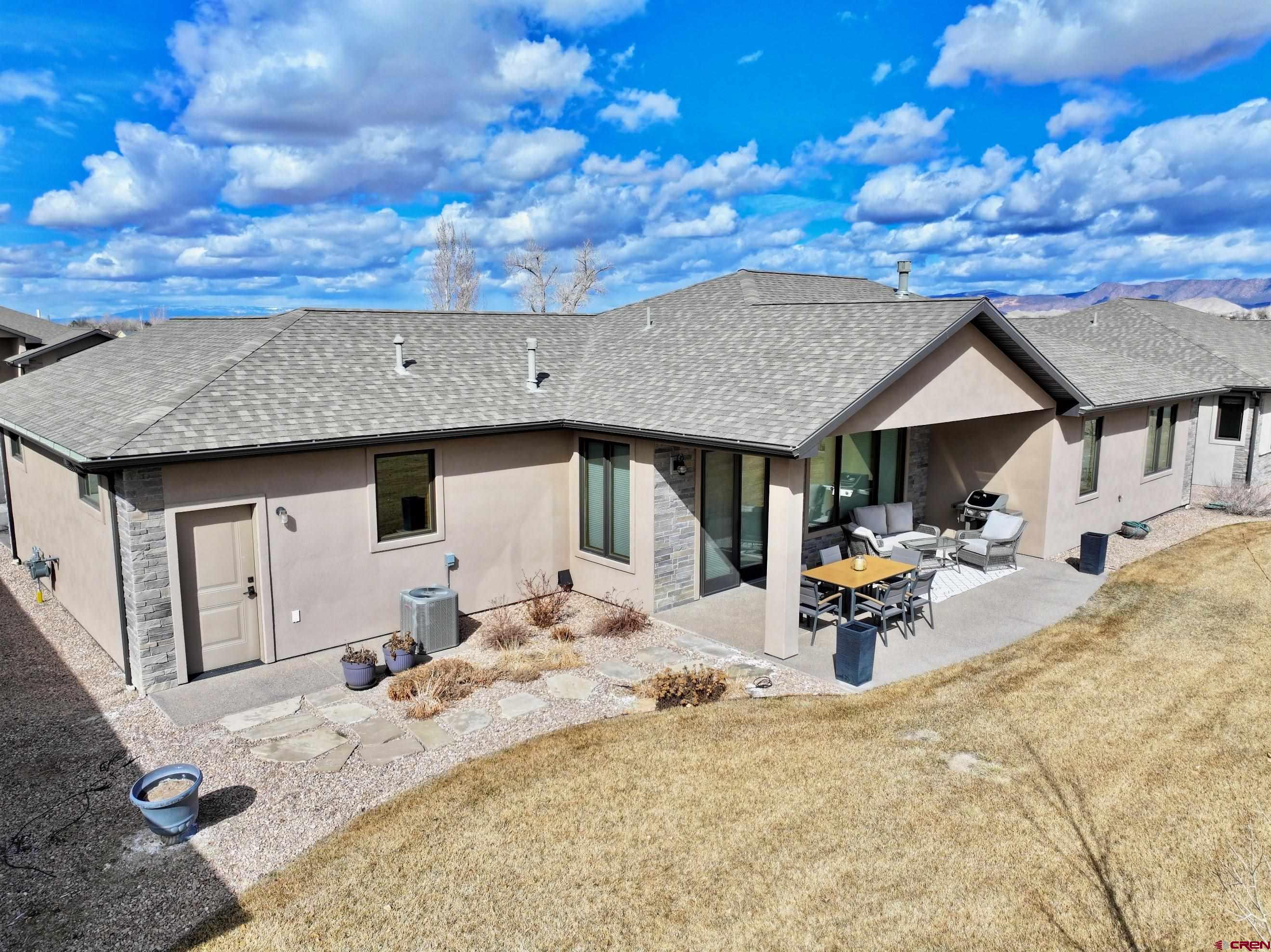 2136 Signature Ridge Lane Montrose, CO 81401 - Photo 2 of 32 a view of a house with snow on the ground