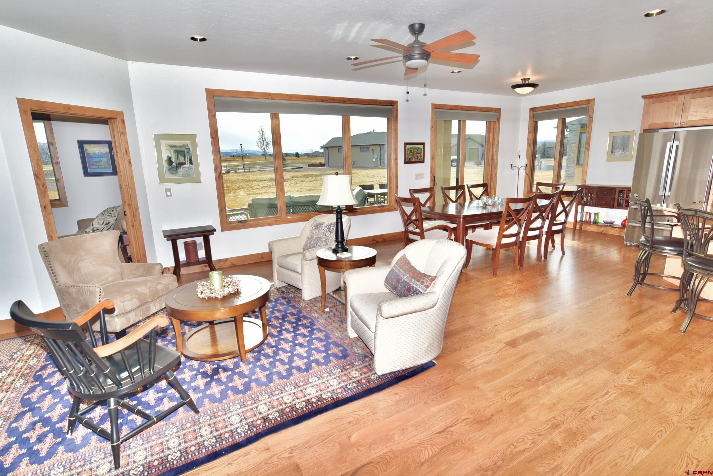 2136 Signature Ridge Lane Montrose, CO 81401 - Photo 21 of 32 a living room with fireplace furniture and a large window
