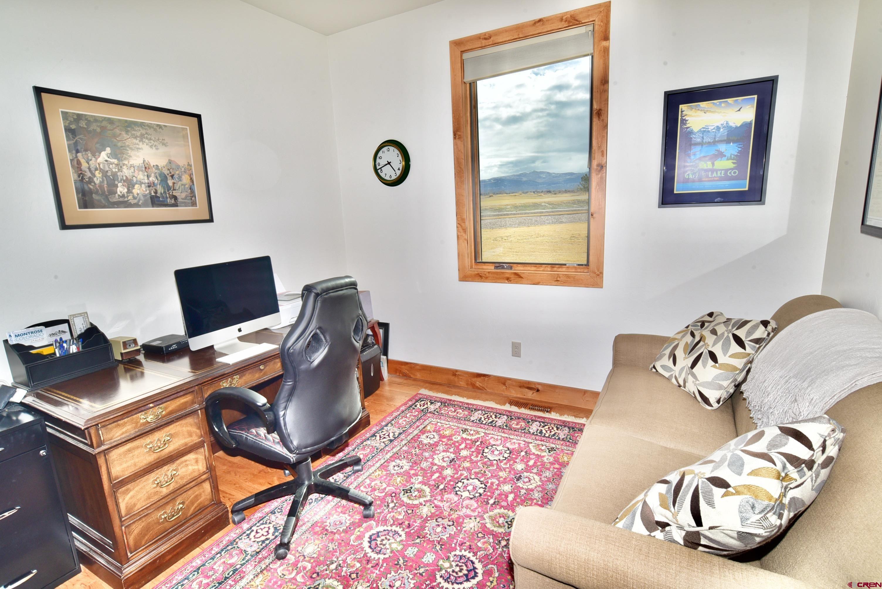 2136 Signature Ridge Lane Montrose, CO 81401 - Photo 31 of 32 a workspace with furniture and a window