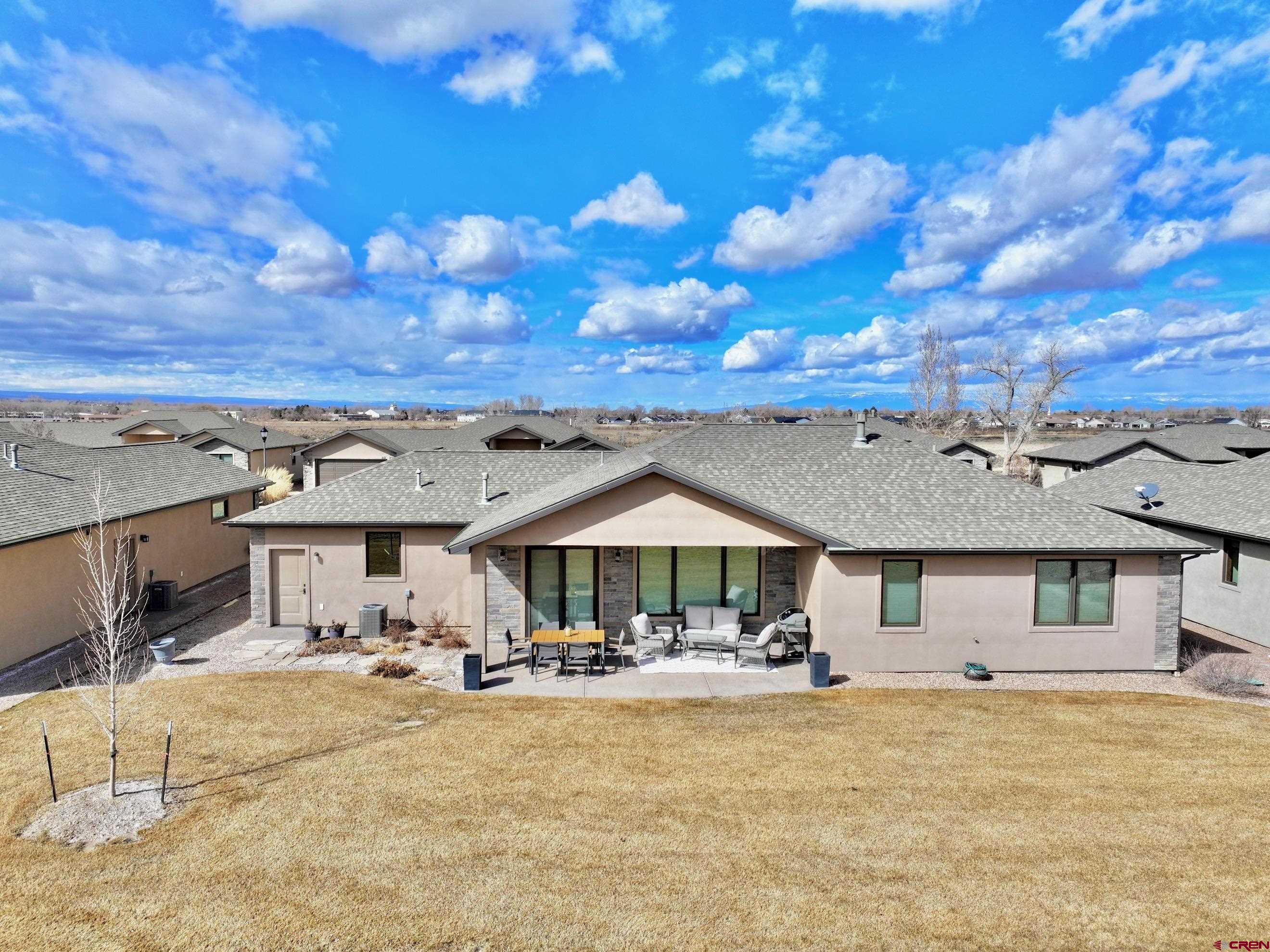 2136 Signature Ridge Lane Montrose, CO 81401 - Photo 4 of 32 a front view of a house with yard patio and kitchen