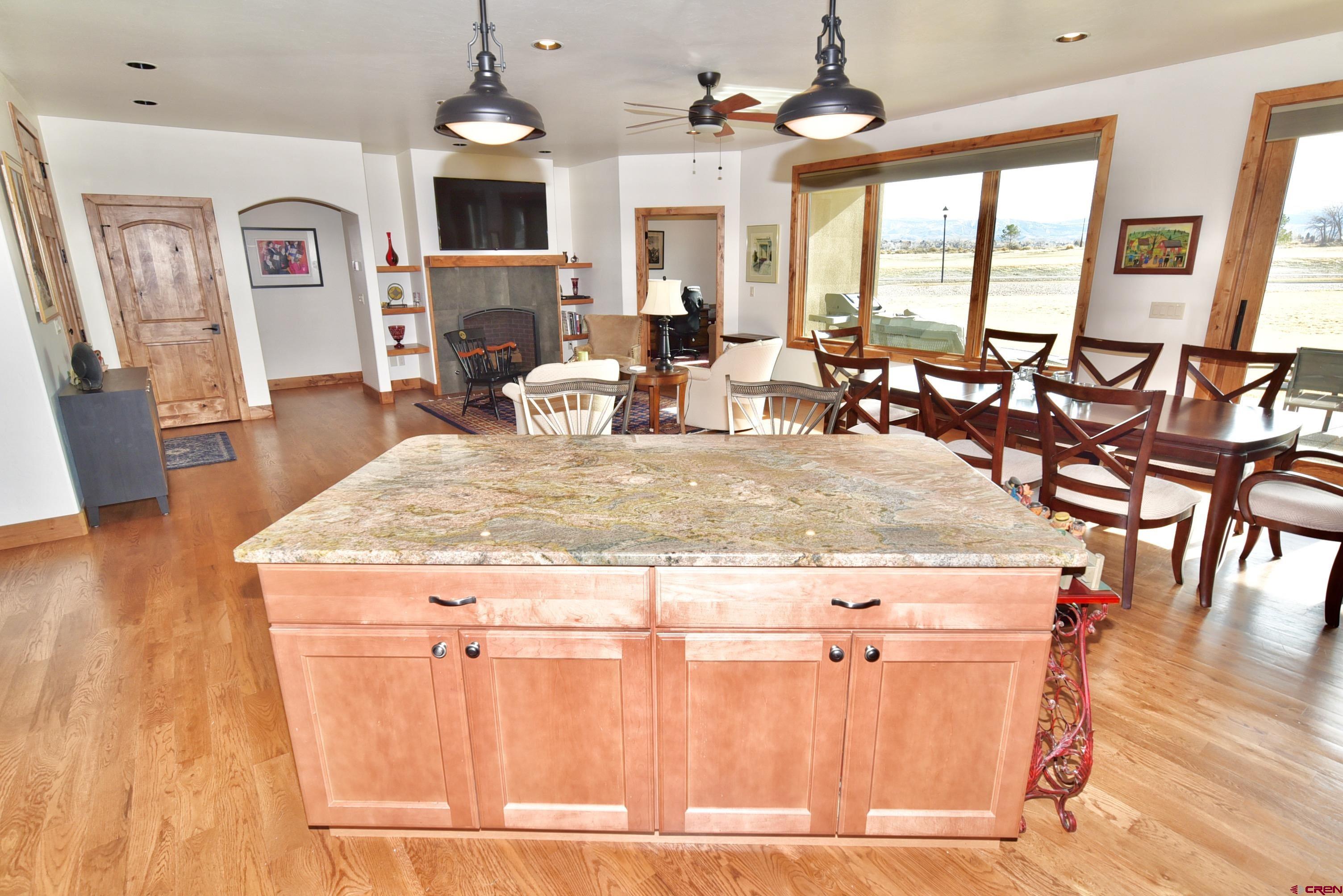 2136 Signature Ridge Lane Montrose, CO 81401 - Photo 6 of 32 a view of living room with granite countertop furniture and fireplace