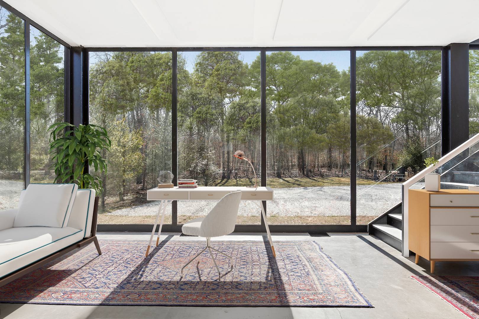 145 Neck Path East Hampton, NY 11937 - Photo 3 of 8 a living room with a large window and a table