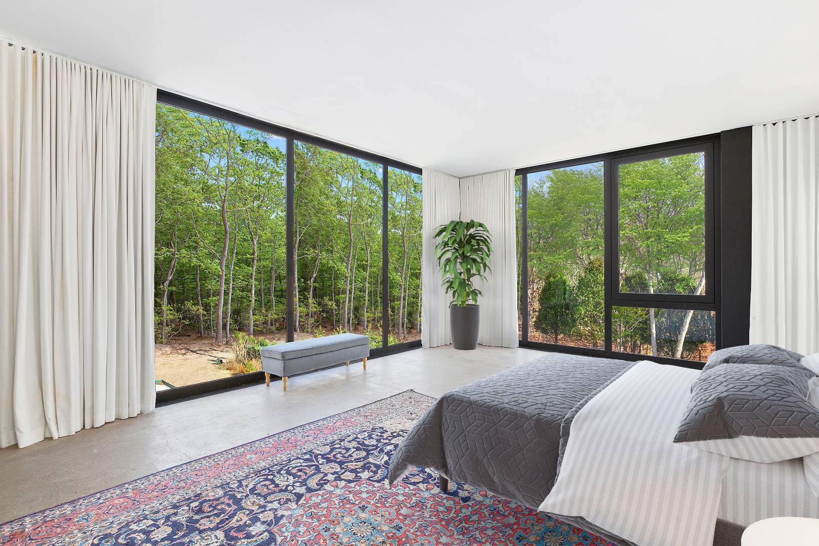 145 Neck Path East Hampton, NY 11937 - Photo 4 of 8 a large bedroom with a bed and a large window