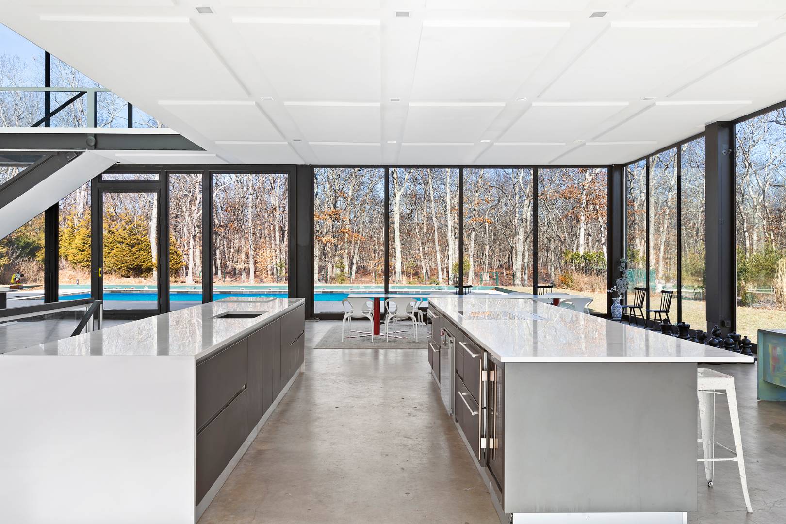 145 Neck Path East Hampton, NY 11937 - Photo 6 of 8 a living room with a large window and a table