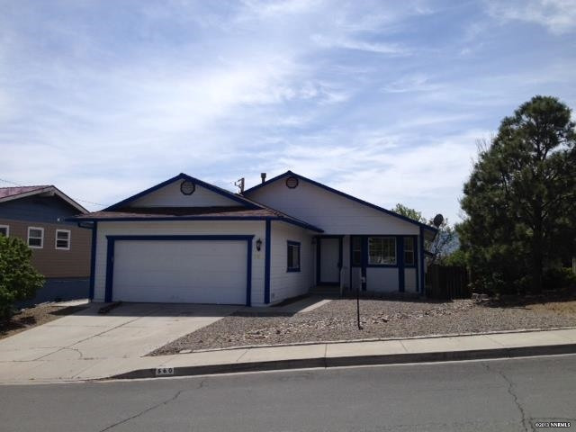 560 Talus Way Reno, NV 89503 - Photo 1 of 1 a front view of a house with a yard and garage
