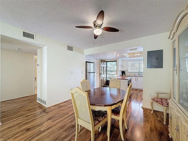 a view of a dining room with furniture and wooden floor