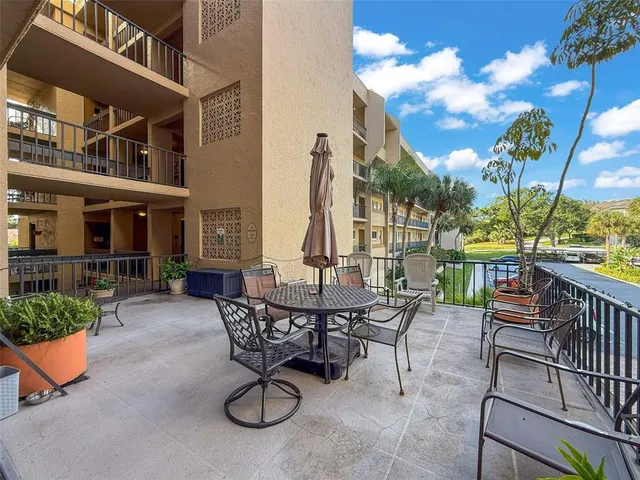 a view of a patio with a table and chairs