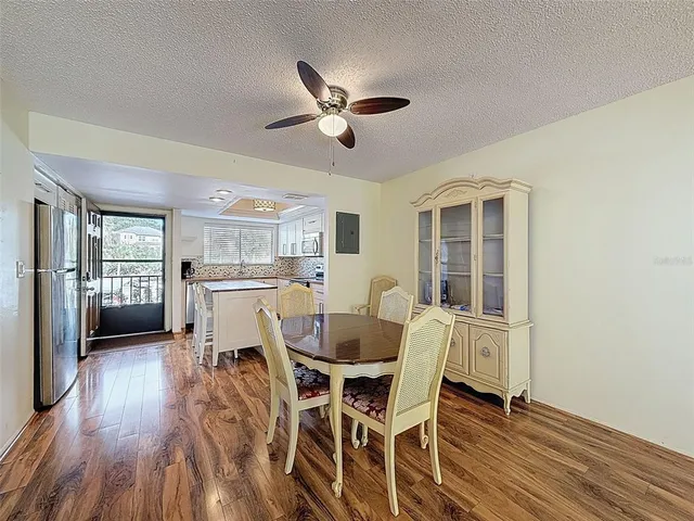 a dining room with furniture and window