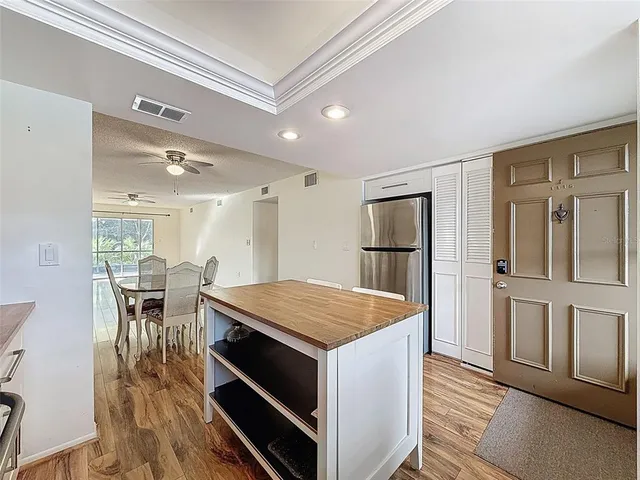 a kitchen that has a table and chairs in it