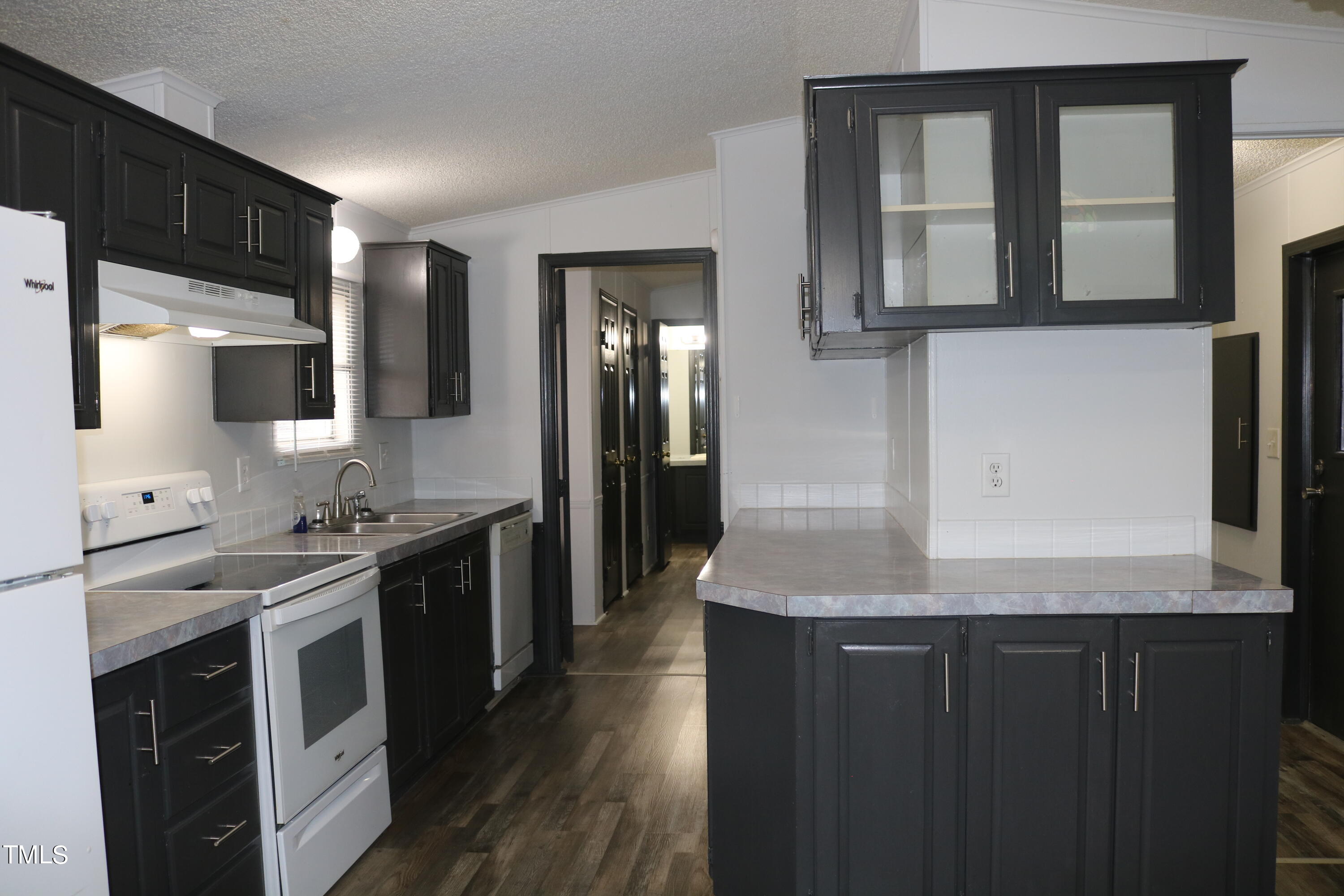 3537 Langston Road Raleigh, NC 27610 - Photo 6 of 21 a kitchen with stainless steel appliances granite countertop a stove a sink and a microwave