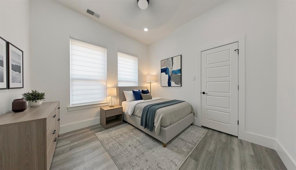 3248 North Cardinal Road Azle, TX 76020 - Photo 21 of 29 Bedroom featuring wood-finish flooring, two large windows with blinds, a five-panel interior door with matte black hardware, recessed lighting, and a ceiling fan