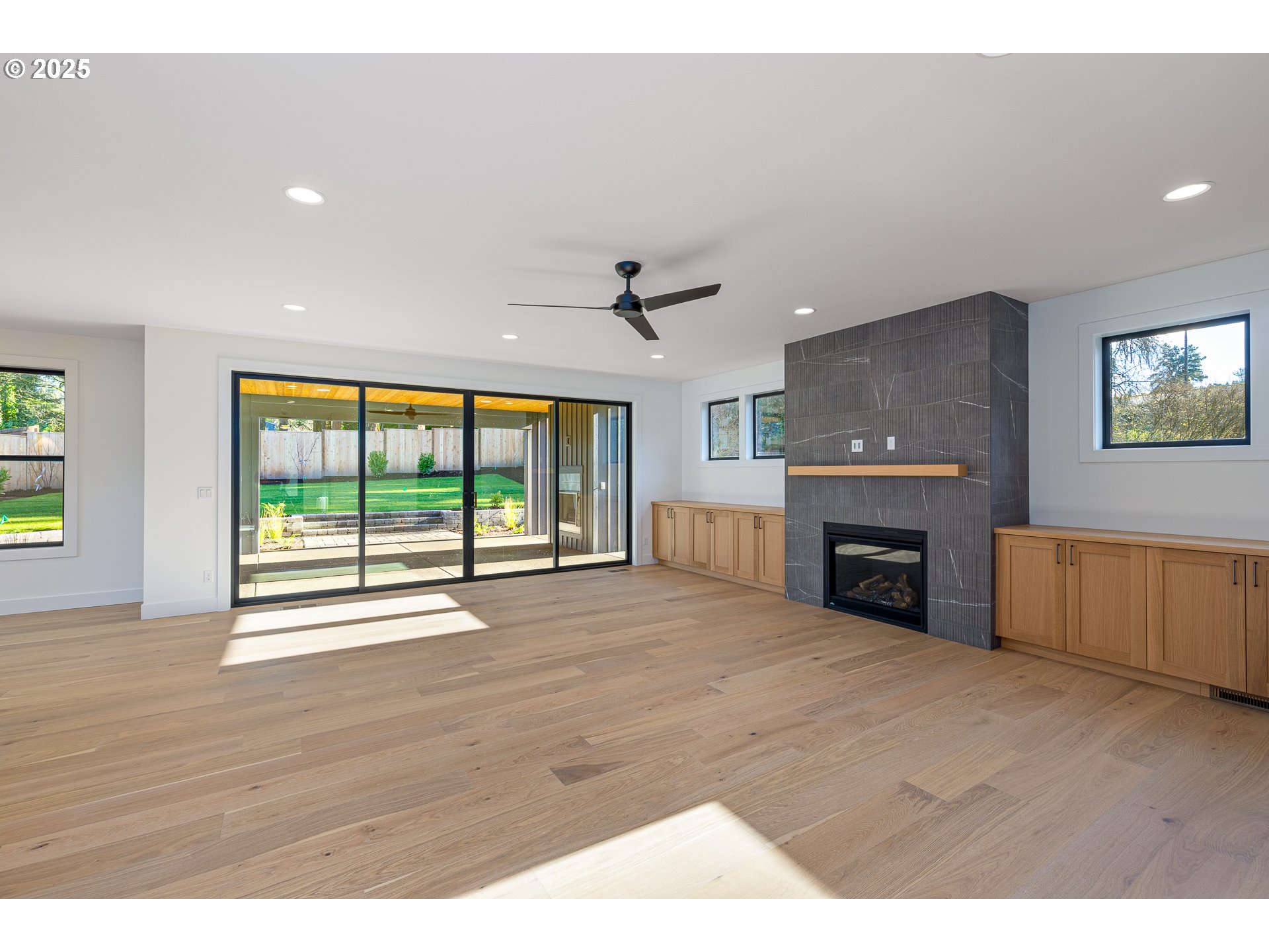 1855 Cloverleaf Road Lake Oswego, OR 97034 - Photo 14 of 34 a view of an empty room with a fireplace and a window