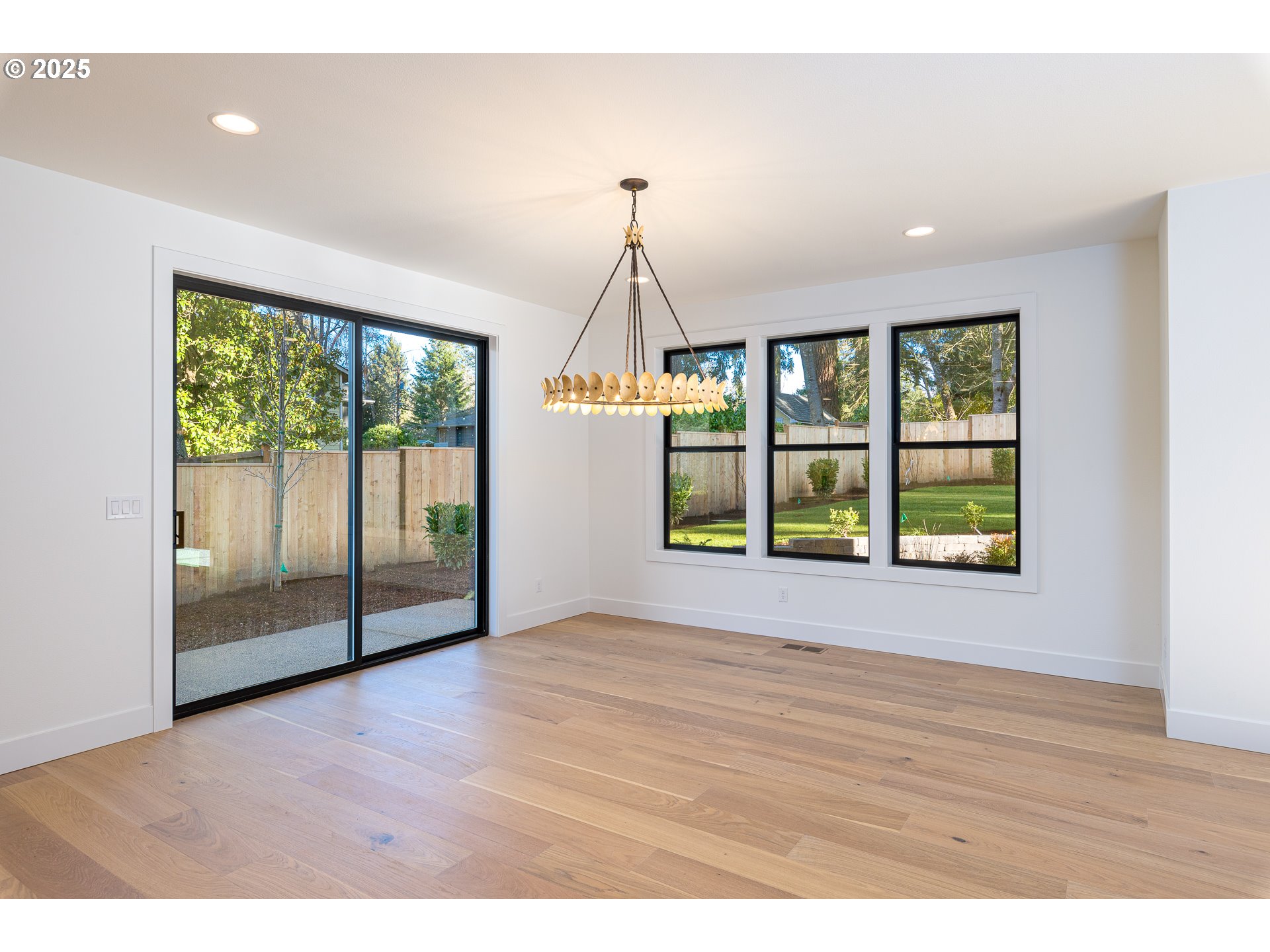 1855 Cloverleaf Road Lake Oswego, OR 97034 - Photo 16 of 34 a view of an empty room with wooden floor and a window