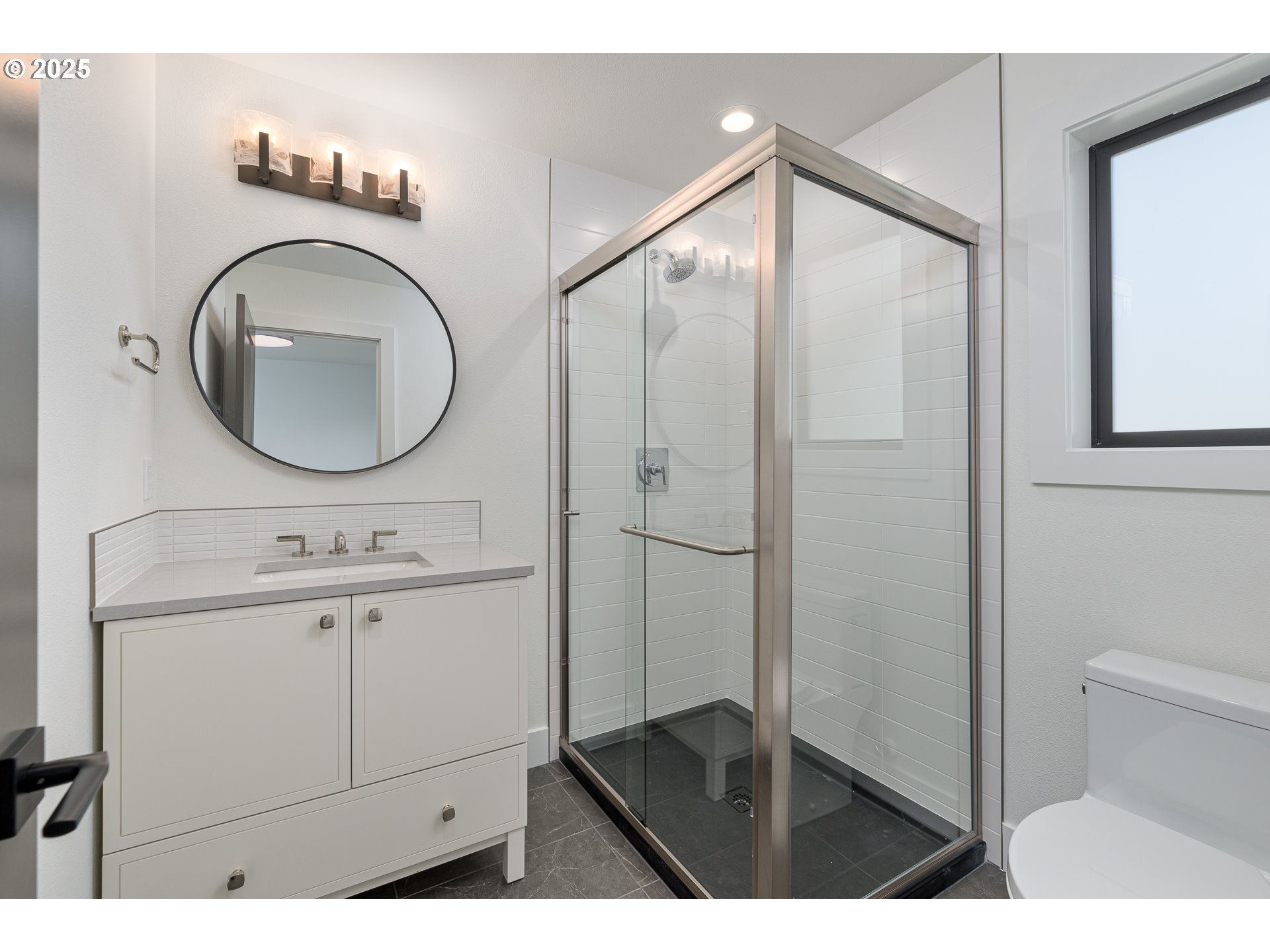 1855 Cloverleaf Road Lake Oswego, OR 97034 - Photo 31 of 34 a bathroom with a sink a vanity and a mirror