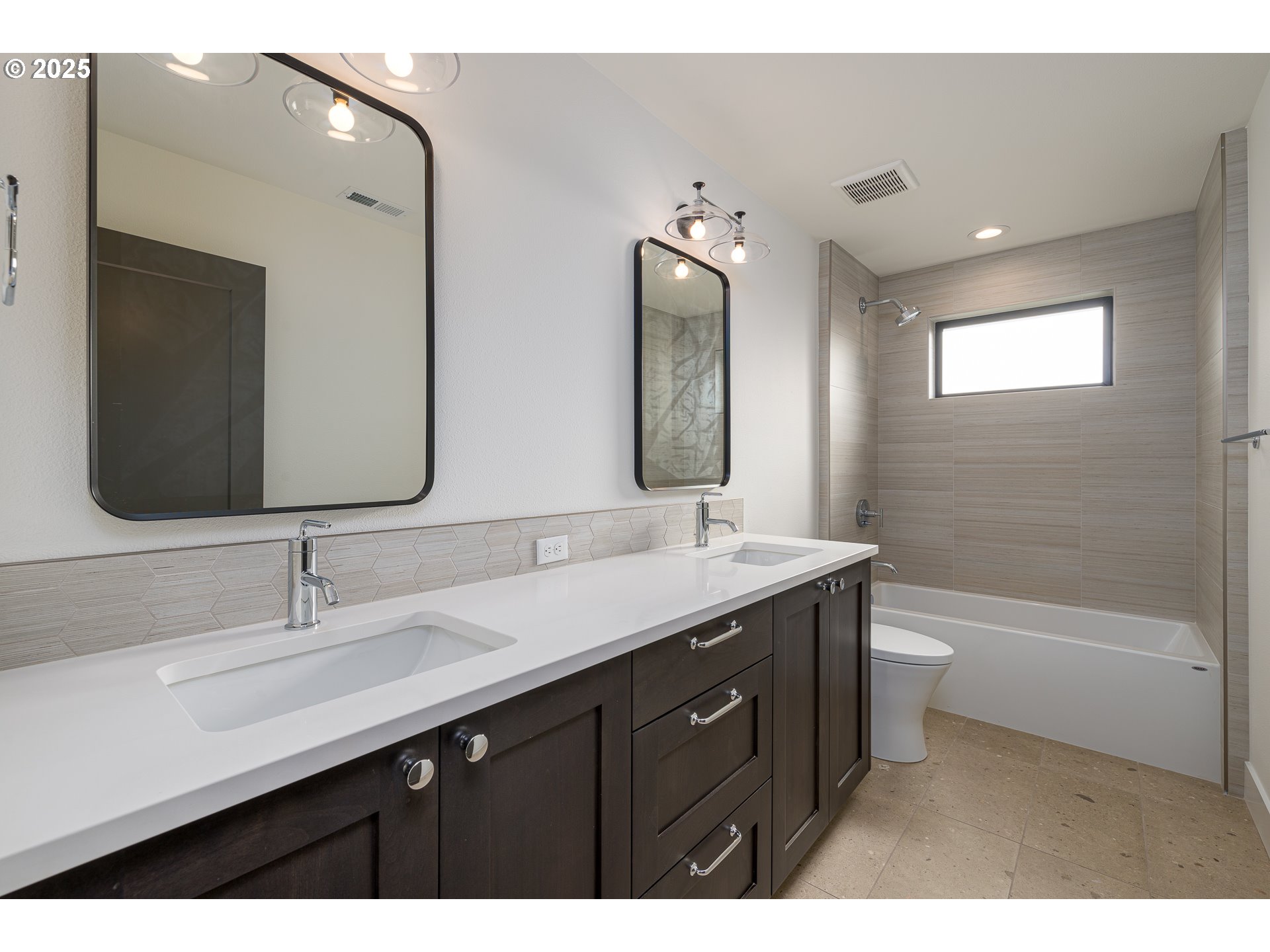 1855 Cloverleaf Road Lake Oswego, OR 97034 - Photo 33 of 34 a bathroom with a double vanity sink and mirror with bathtub