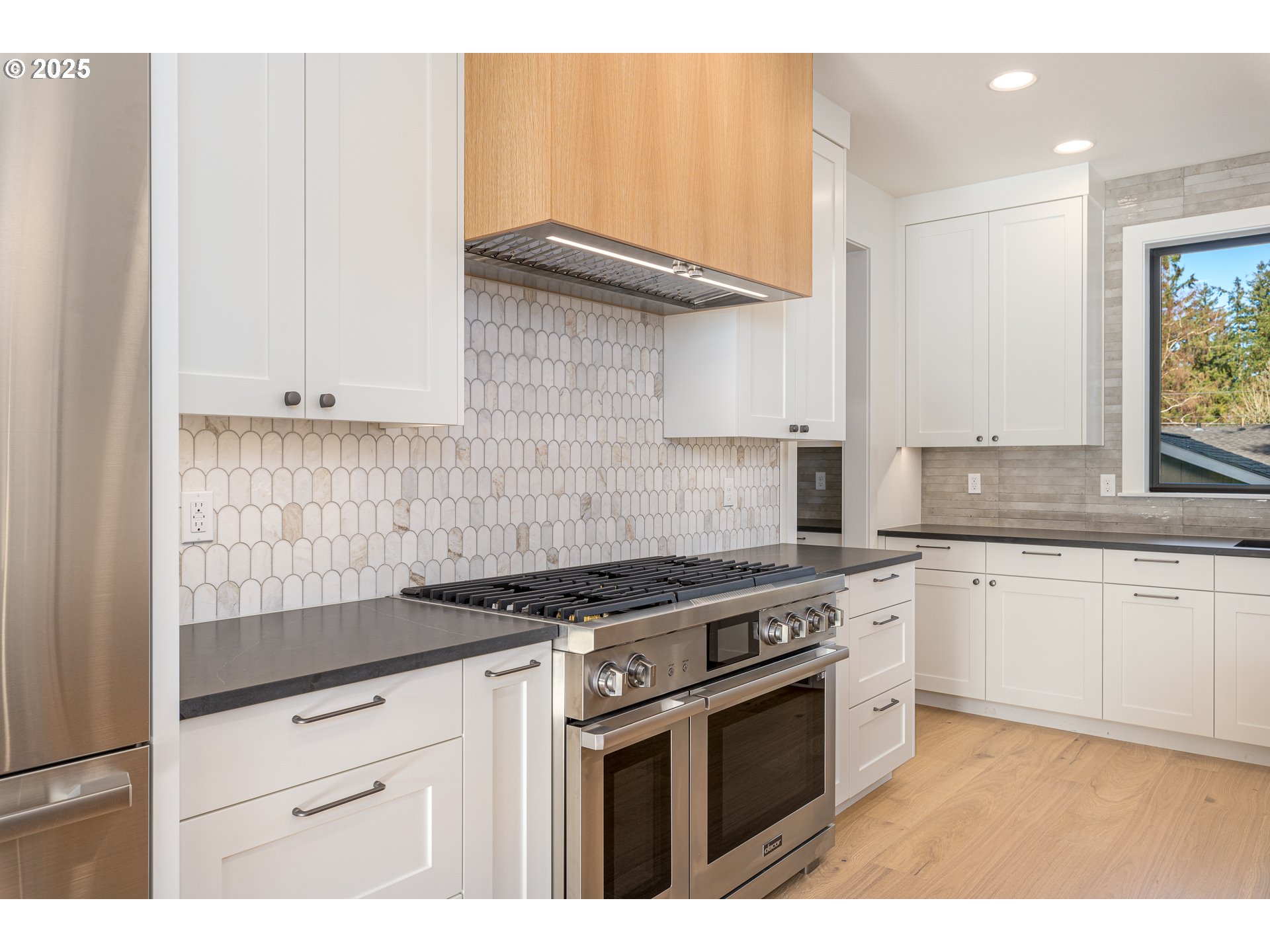 1855 Cloverleaf Road Lake Oswego, OR 97034 - Photo 9 of 34 a white kitchen with granite countertop stainless steel appliances