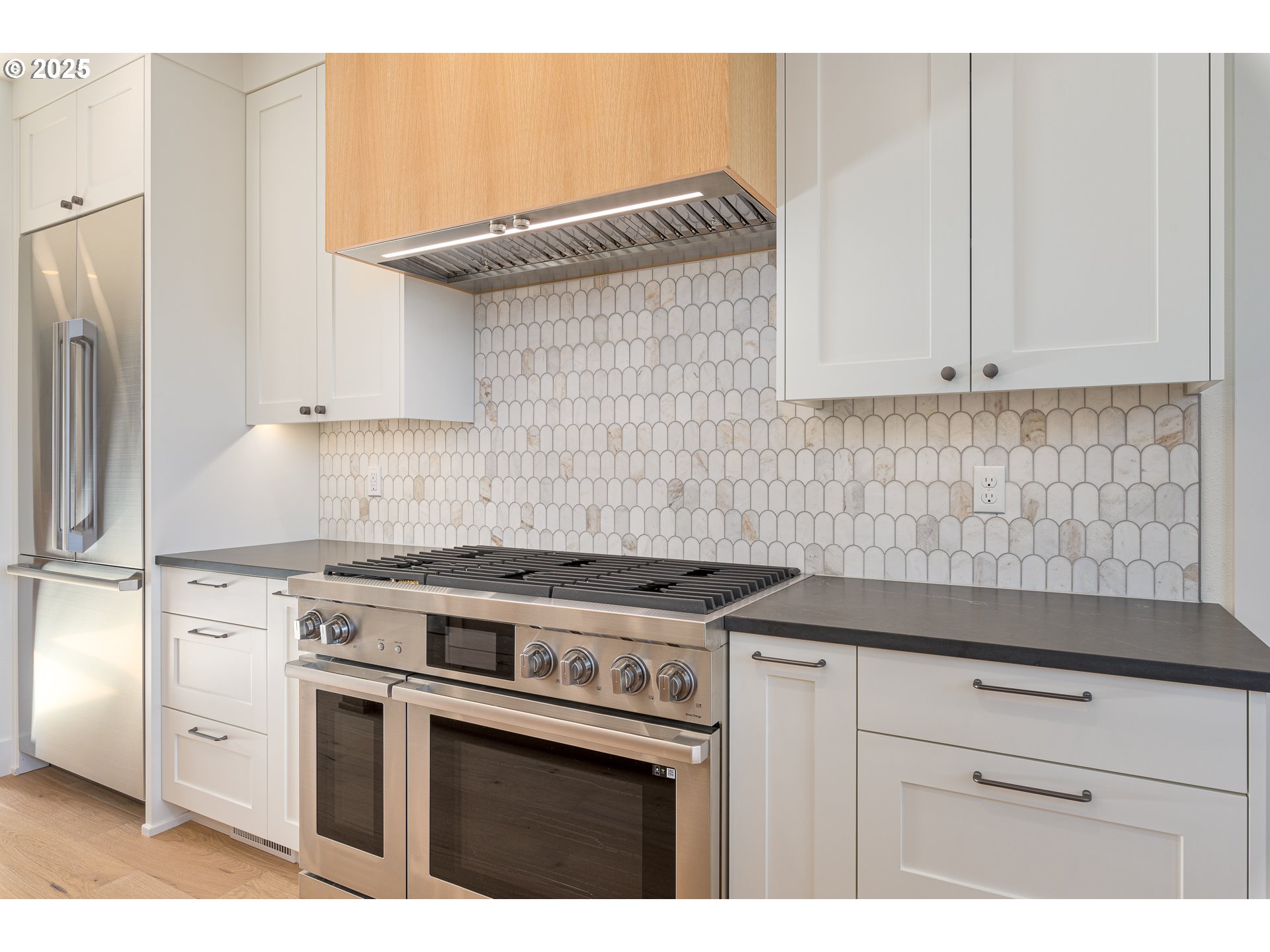 1855 Cloverleaf Road Lake Oswego, OR 97034 - Photo 10 of 34 a kitchen with granite countertop a stove sink and cabinets