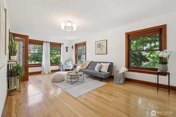 a living room with furniture and a large window