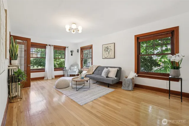 a living room with furniture and a large window