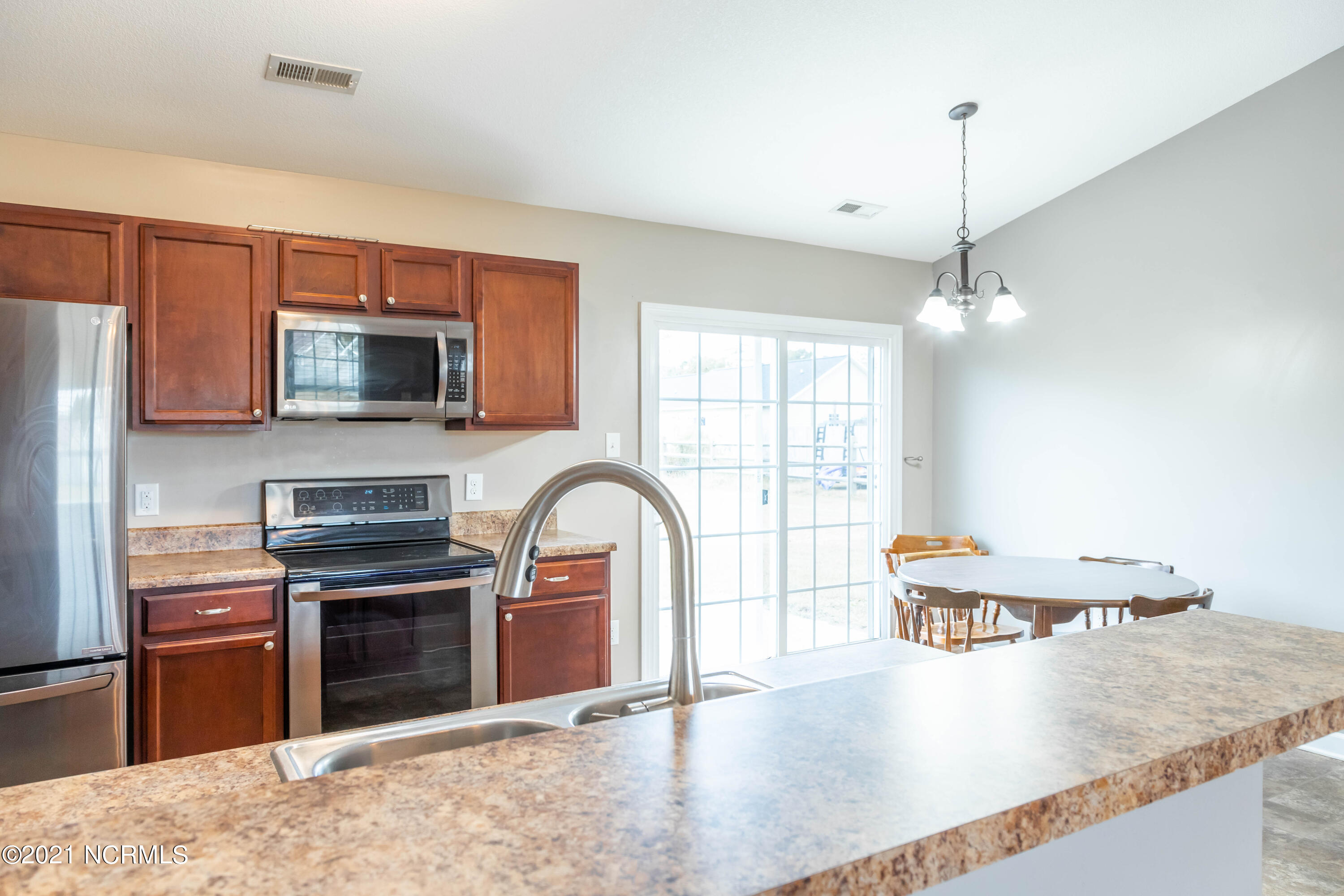 223 Loren Road Hubert, NC 28539 - Photo 5 of 25 Kitchen and Dining Area