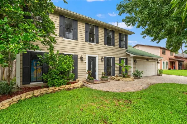 front view of a house with a yard