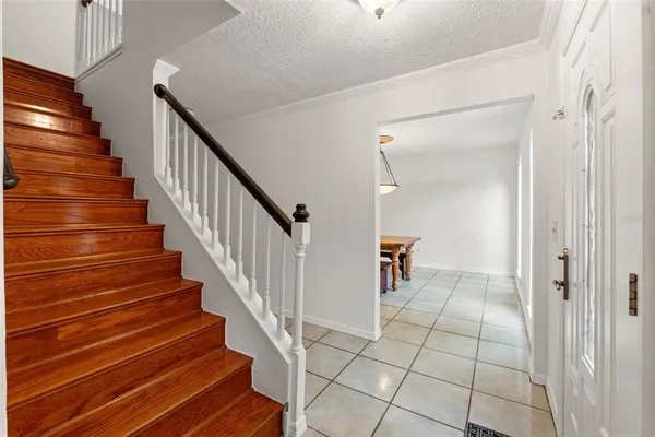 a living room with a table and chairs