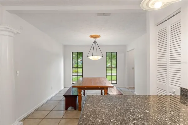 a kitchen with stainless steel appliances a refrigerator a stove a sink a counter top space and cabinets