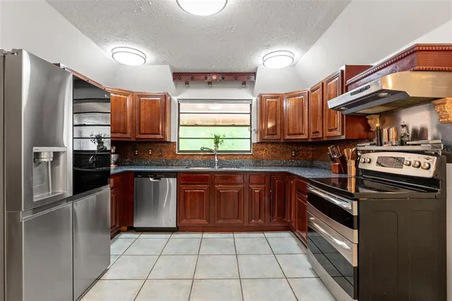 a view of a room with furniture and window