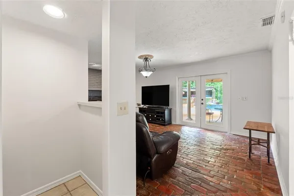 a front view of a house with a yard table and chairs