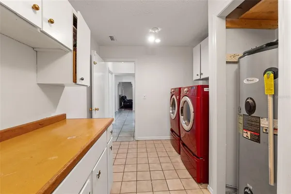 a view of a hallway with wooden floor and entryway