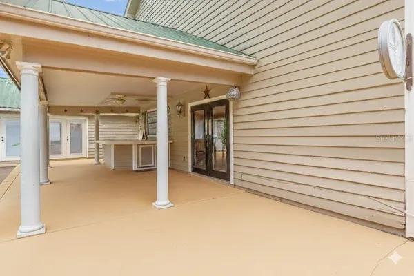 a bathroom with a granite countertop sink mirror vanity and toilet