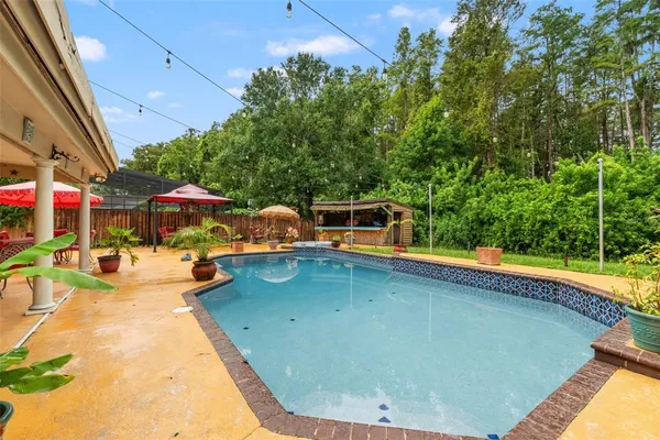 a bathroom with a granite countertop sink and a window