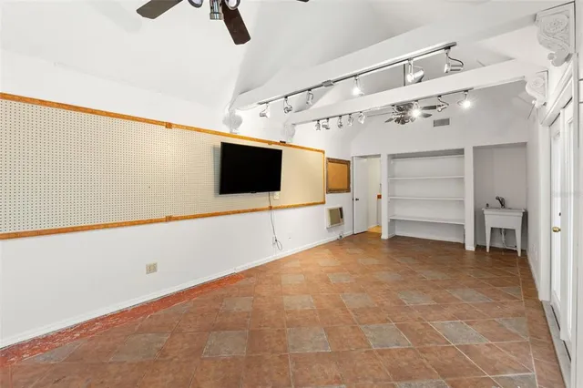 a bathroom with a granite countertop sink and a window