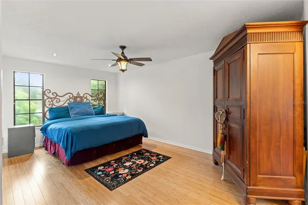 an aerial view of residential houses with outdoor space and lake view