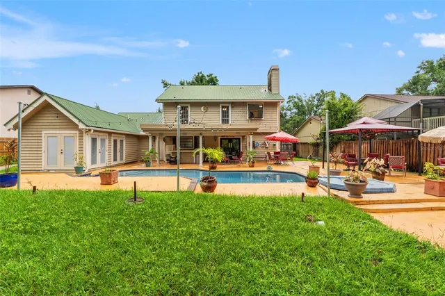 a view of a swimming pool with a patio