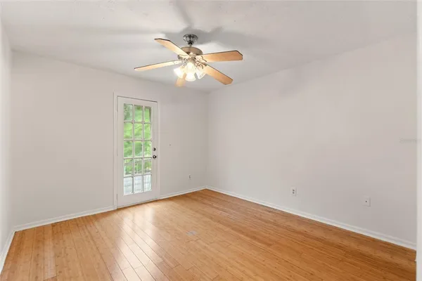 a view of a house with backyard water fountain and sitting area