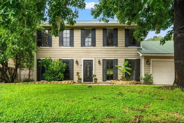 front view of a house with a yard