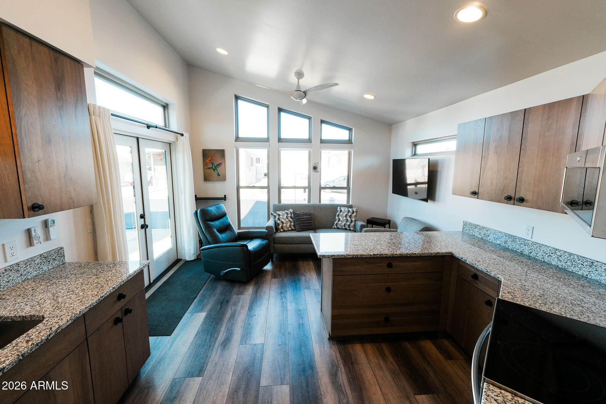17200 West Bell Road, Unit 554 Surprise, AZ 85374 - Photo 11 of 21 a kitchen with sink stove and wooden floor
