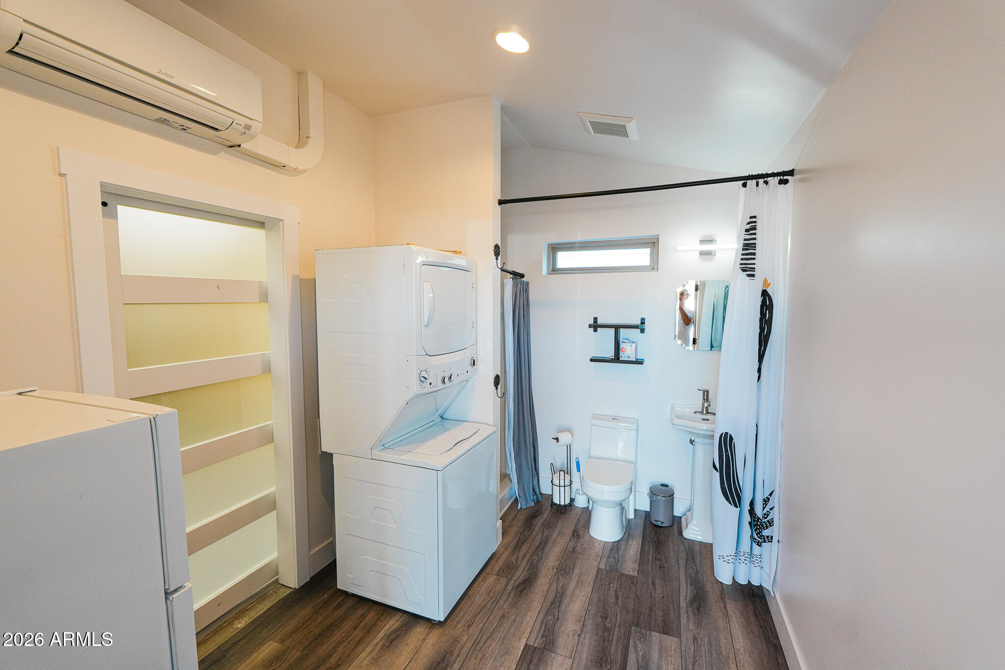 17200 West Bell Road, Unit 554 Surprise, AZ 85374 - Photo 4 of 21 a room with a washer and dryer