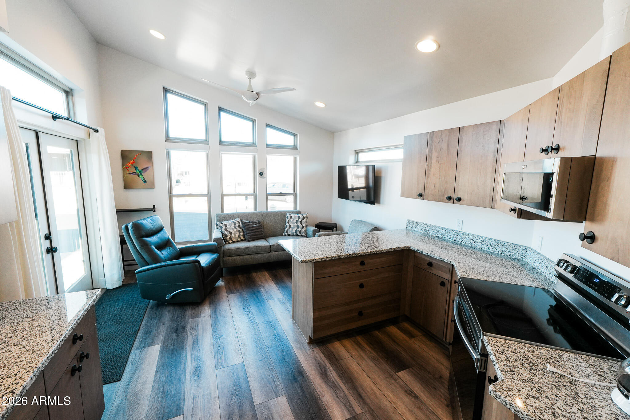 17200 West Bell Road, Unit 554 Surprise, AZ 85374 - Photo 8 of 21 a kitchen with sink cabinets and wooden floor