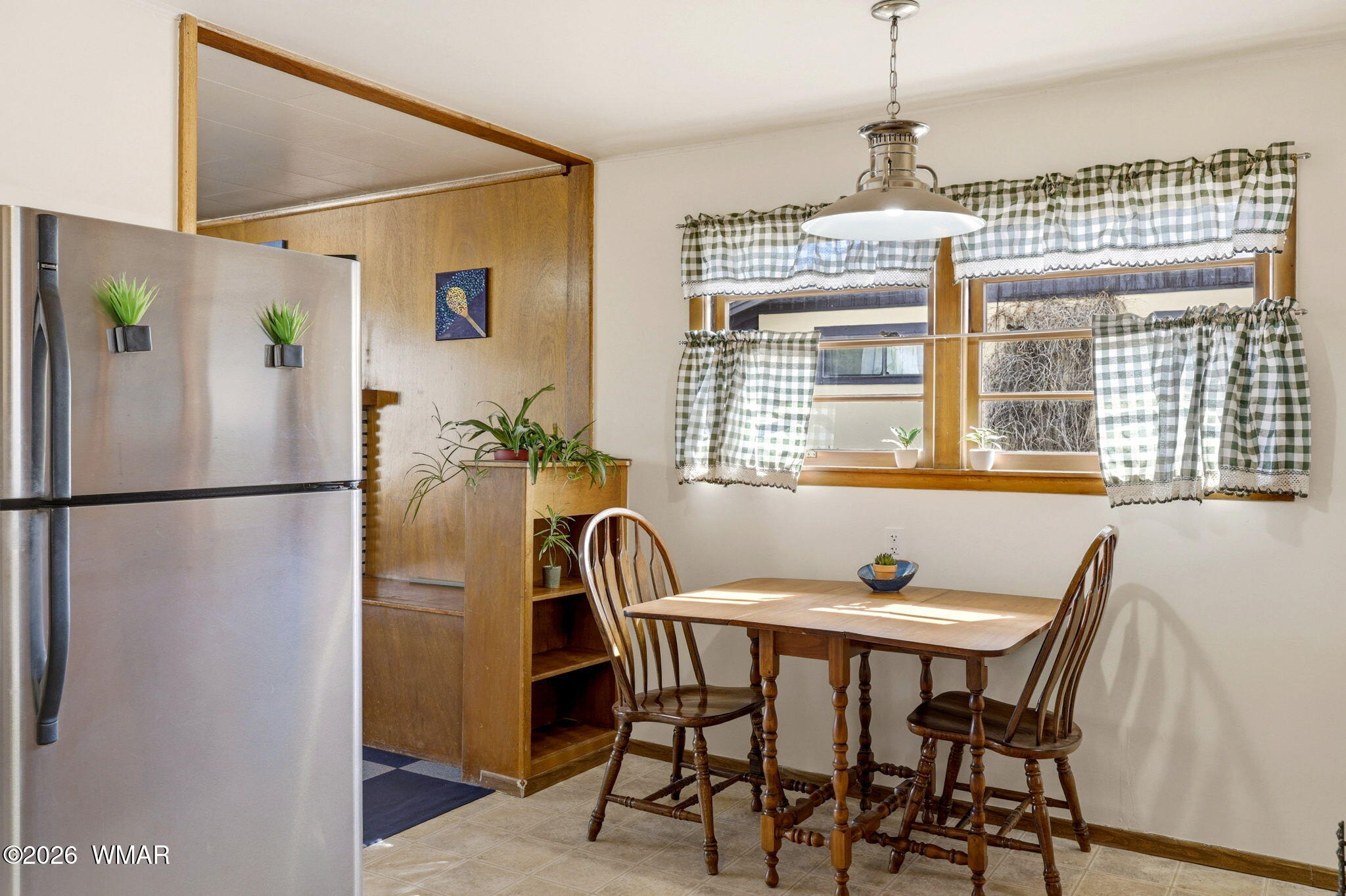 438 East Yaqui Street Springerville, AZ 85938 - Photo 13 of 31 a dining room with furniture a chandelier and wooden floor