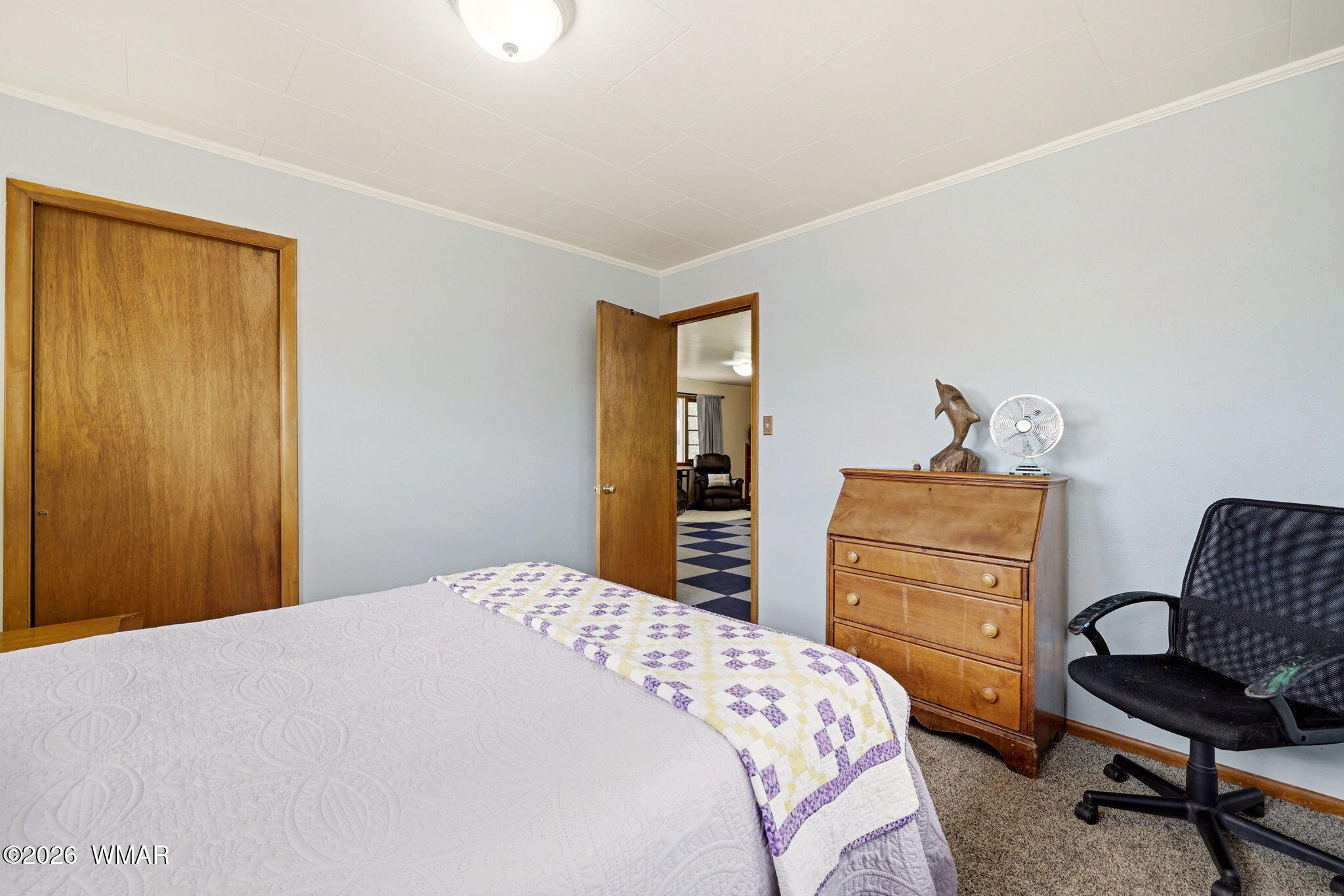 438 East Yaqui Street Springerville, AZ 85938 - Photo 15 of 31 a bedroom with a bed and dresser