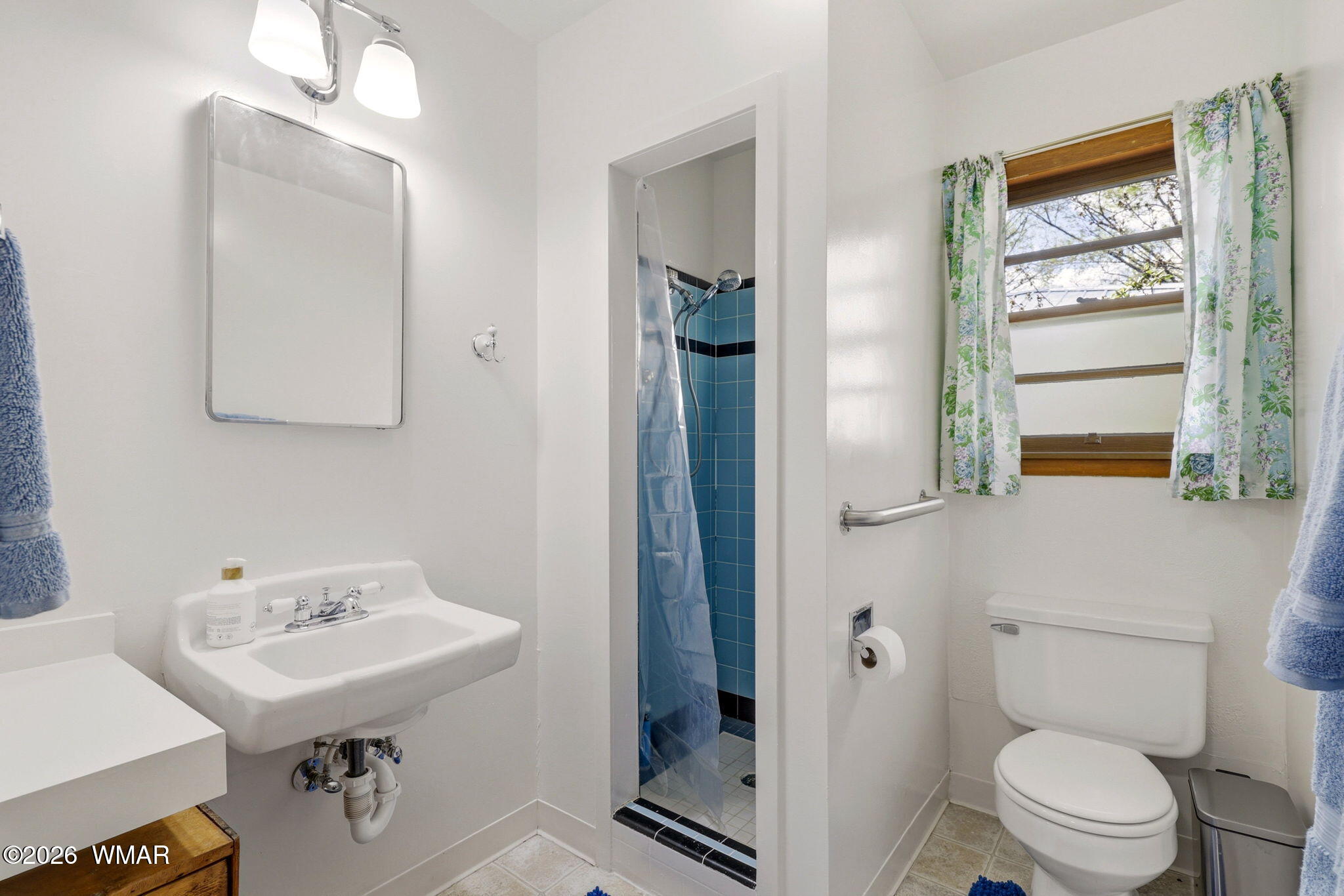 438 East Yaqui Street Springerville, AZ 85938 - Photo 16 of 31 a bathroom with a sink a toilet and shower