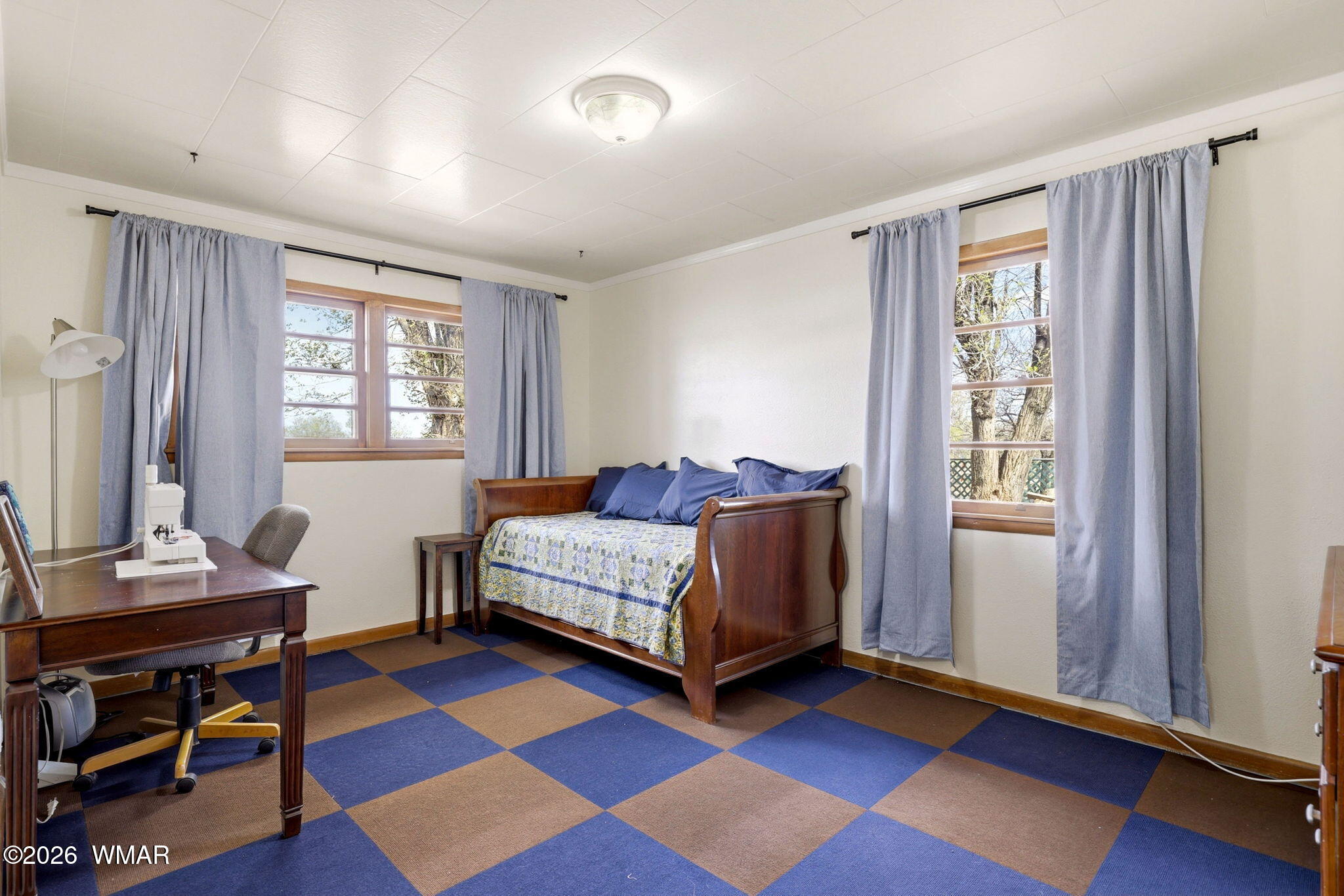 438 East Yaqui Street Springerville, AZ 85938 - Photo 17 of 31 a bedroom with a bed and a window