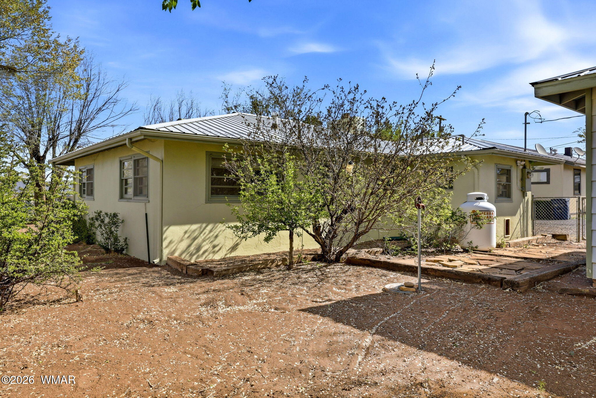 438 East Yaqui Street Springerville, AZ 85938 - Photo 21 of 31 a front view of a house with trees