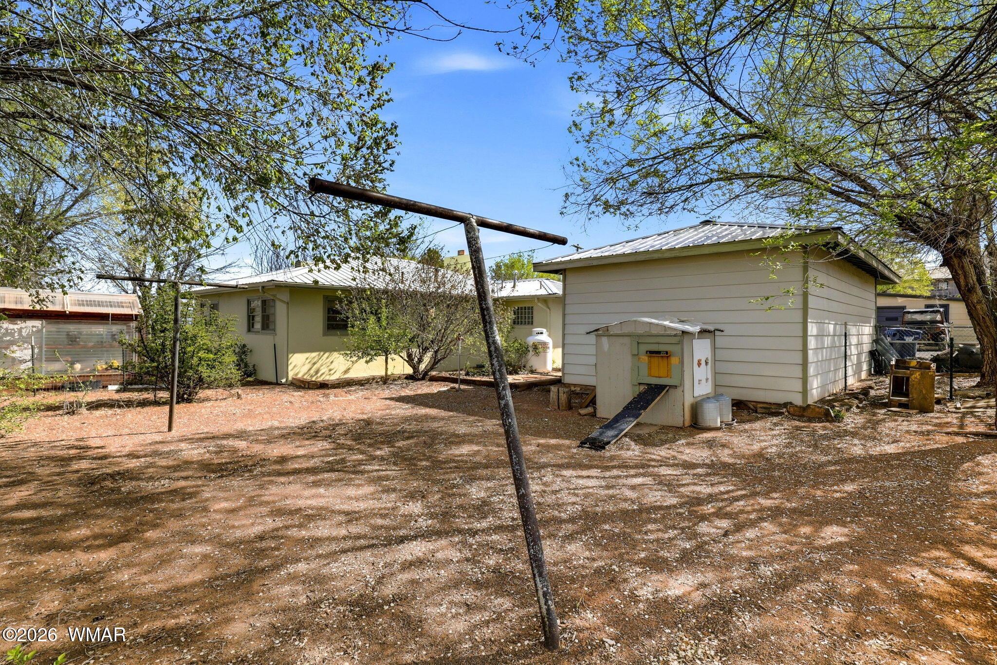 438 East Yaqui Street Springerville, AZ 85938 - Photo 22 of 31 a view of a house with a patio