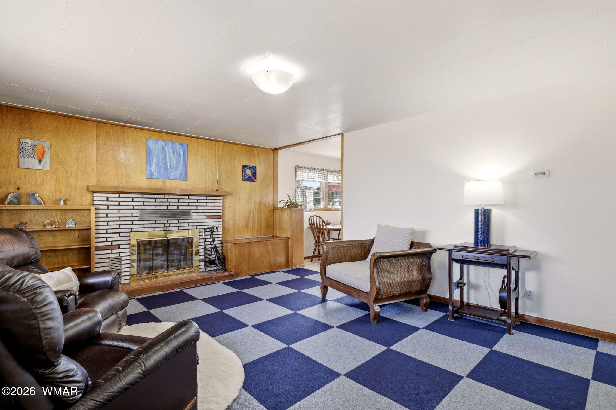 438 East Yaqui Street Springerville, AZ 85938 - Photo 7 of 31 a living room with furniture and a fireplace